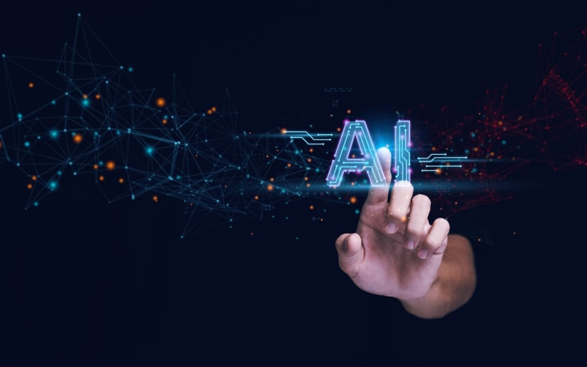 Someone pointing at digital letters AI