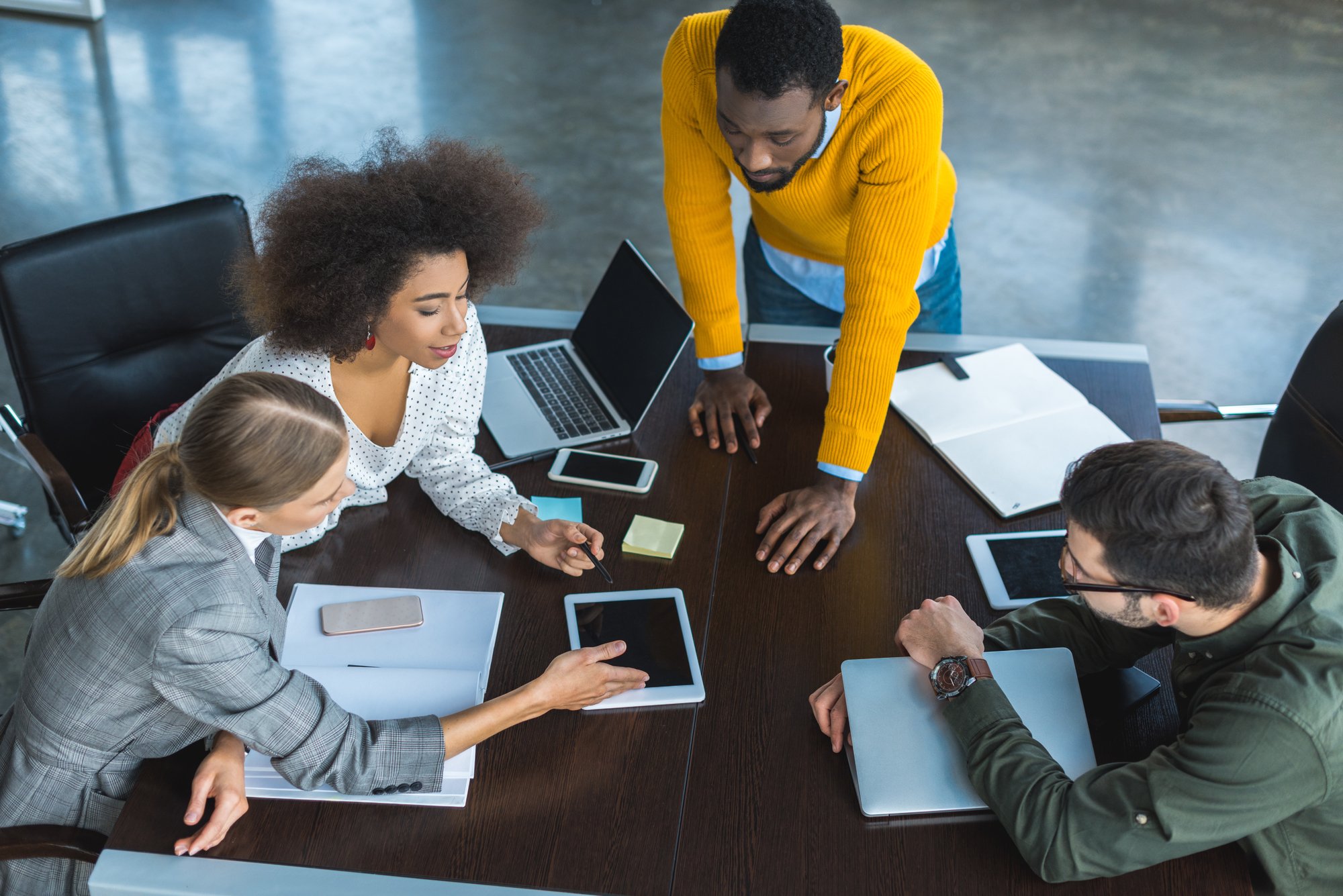 High angle view of multicultural businesspeople at discussion in office