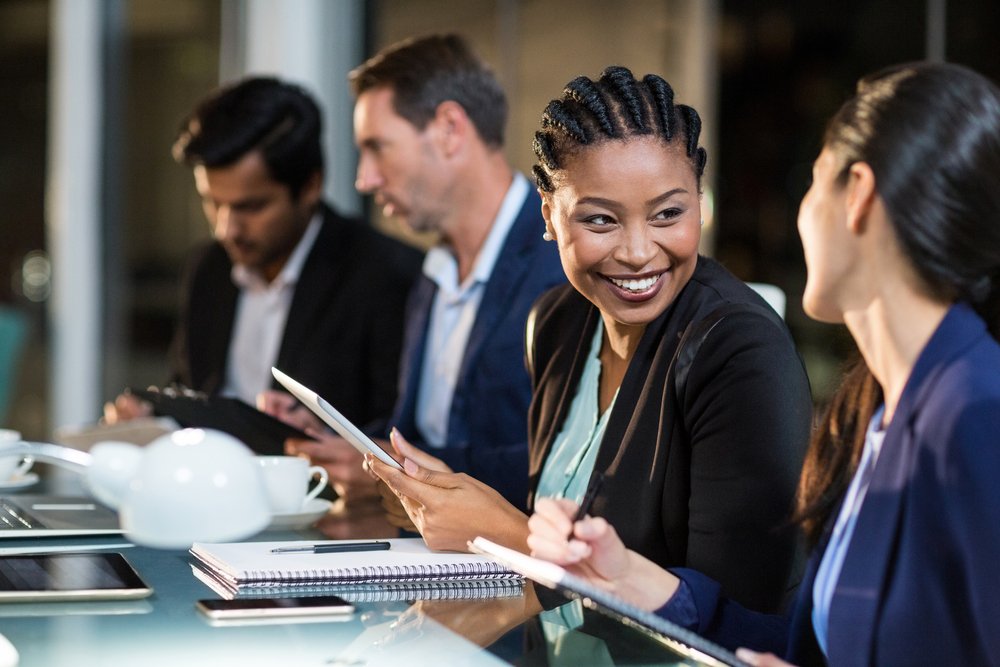 Businesswoman interacting with a colleague in the office