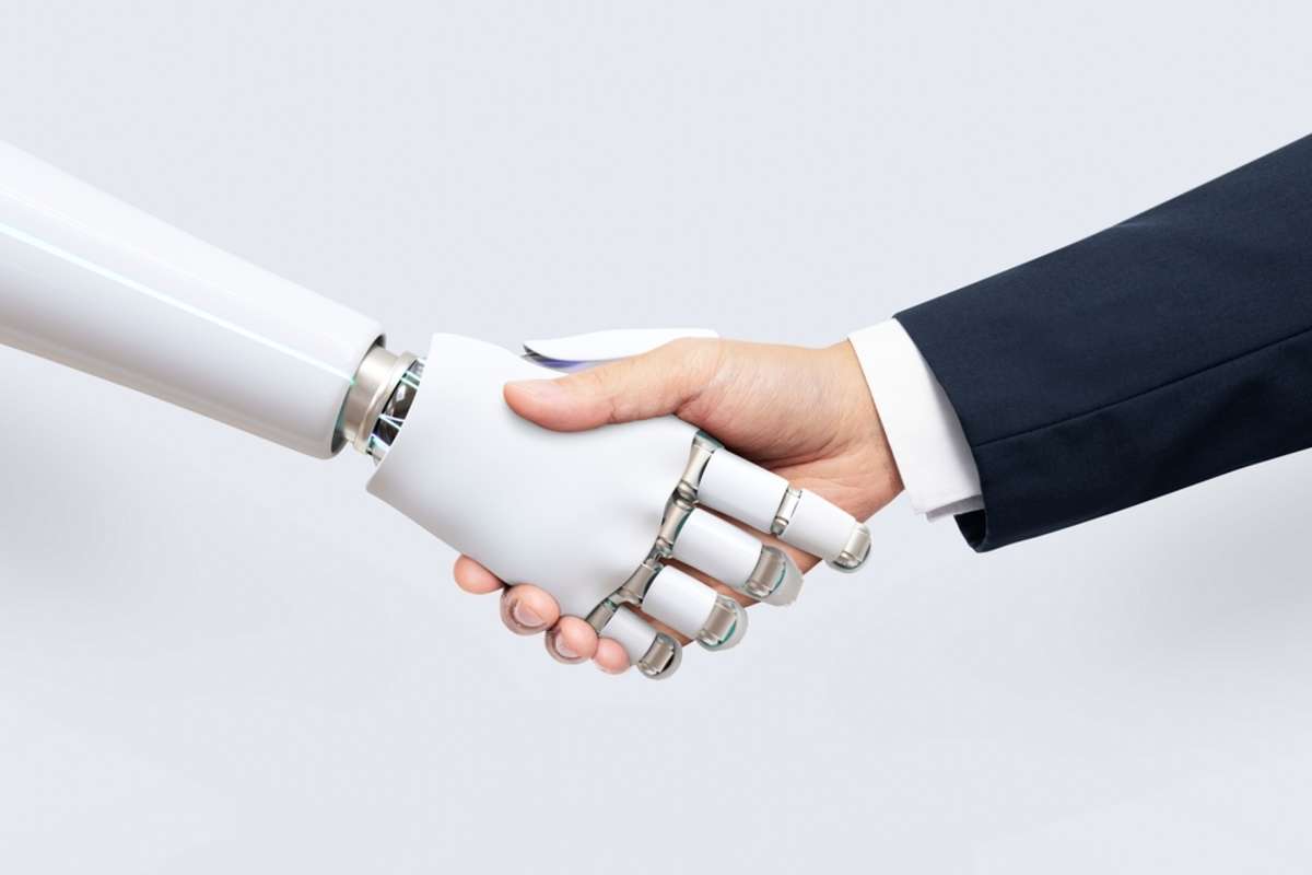 A human shaking hands with AI to show collaboration for AI-generated content
