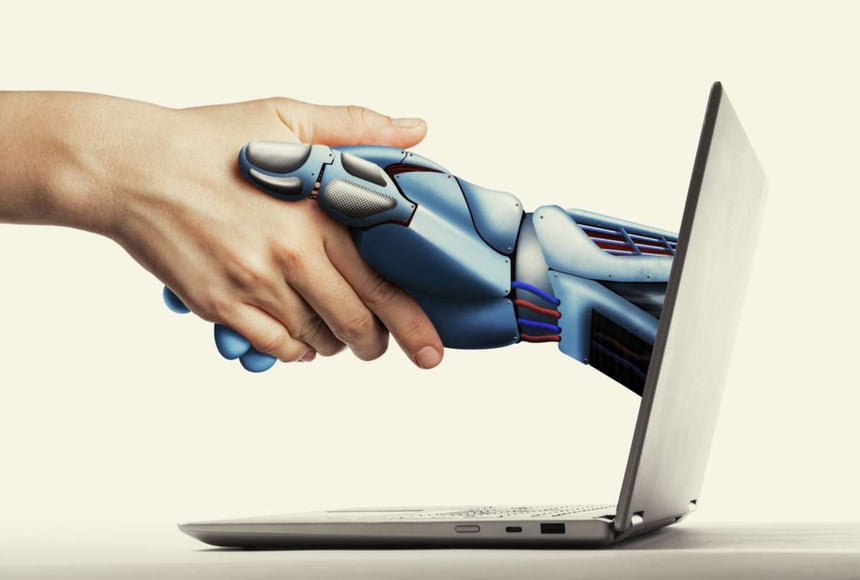 A robot hand comes out of computer screen to shake a human hand, how to use ai in digital marketing concept-1