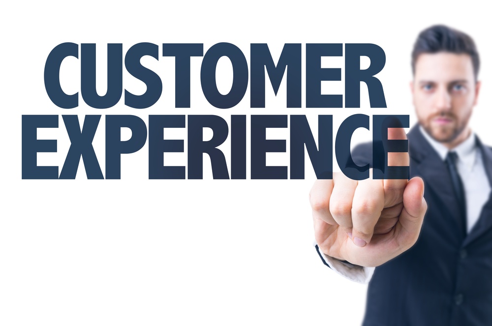 Business man pointing the text Customer Experience-1