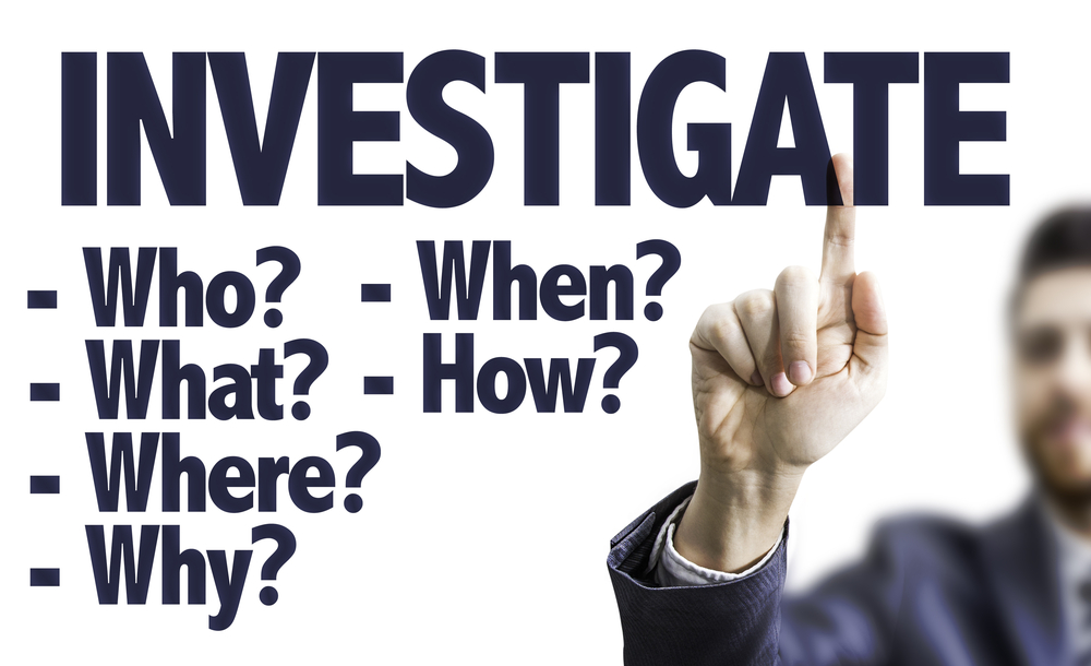 Business man pointing to"Investigate," how to come up with blog post ideas concept. 