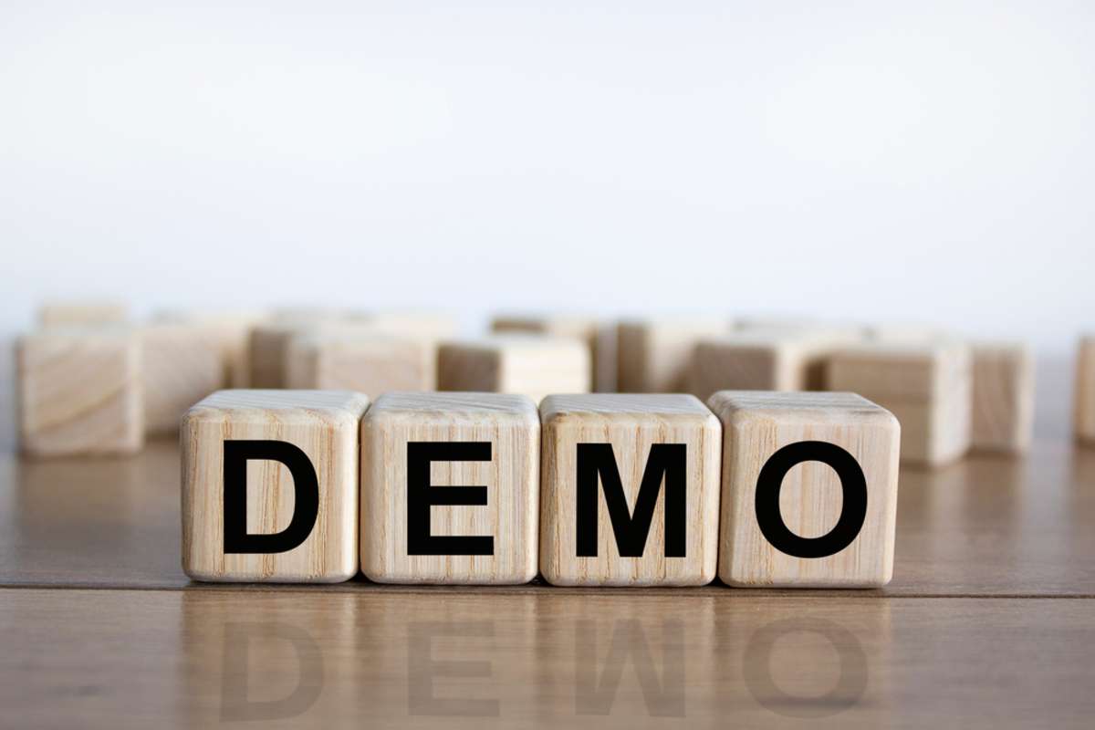 Concept word demo on cubes on a beautiful wooden table