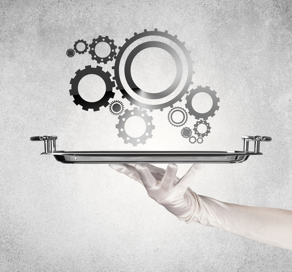 Wheel machine served on silver plate by hand in white glove, lead nurturing concept.