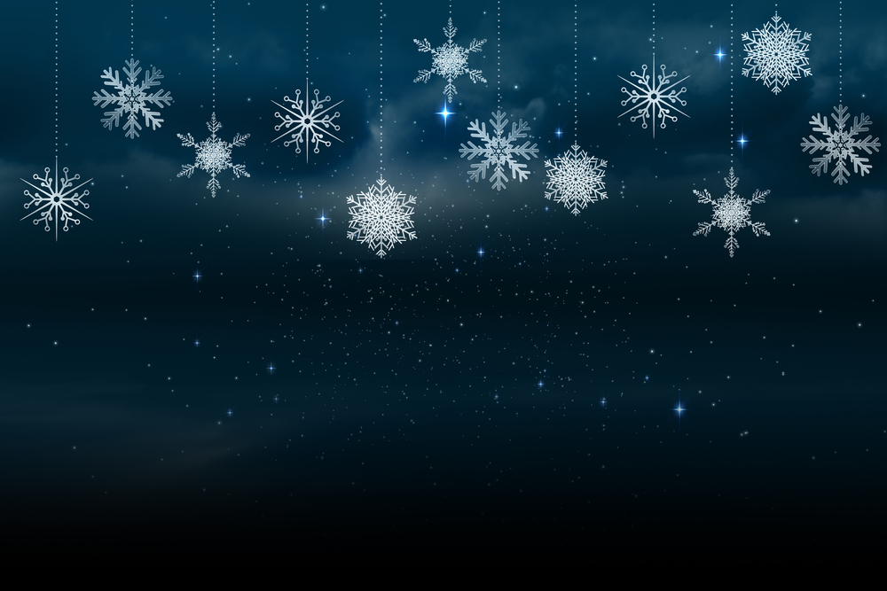 Digitally generated Snowflakes hanging against blue background