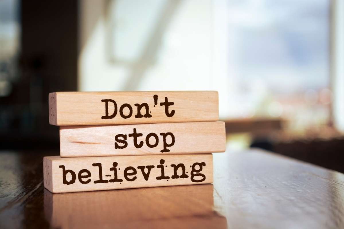 Dont Stop Believing on wooden blocks, property management content concept