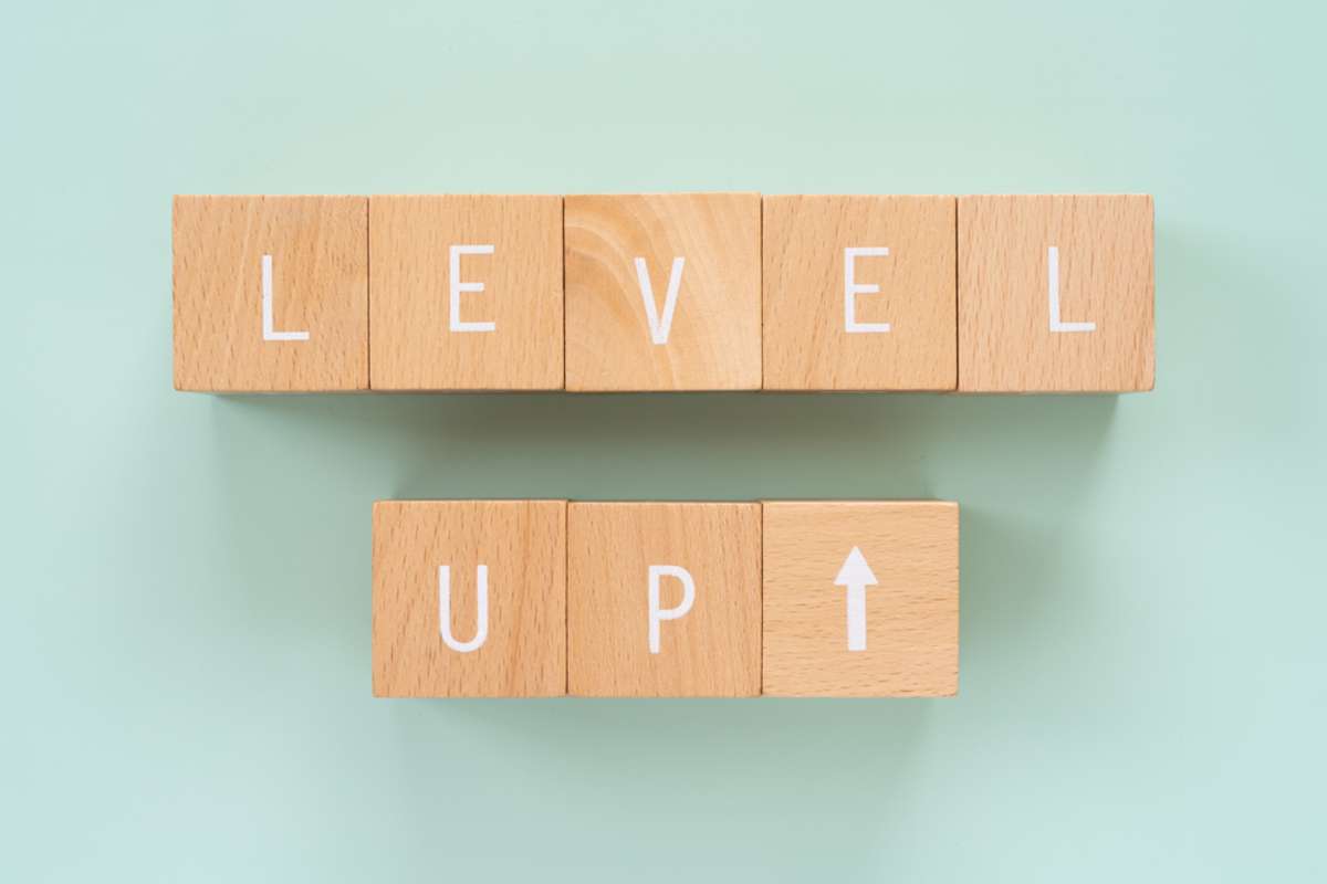 Eight wooden blocks with LEVEL UP text of concept