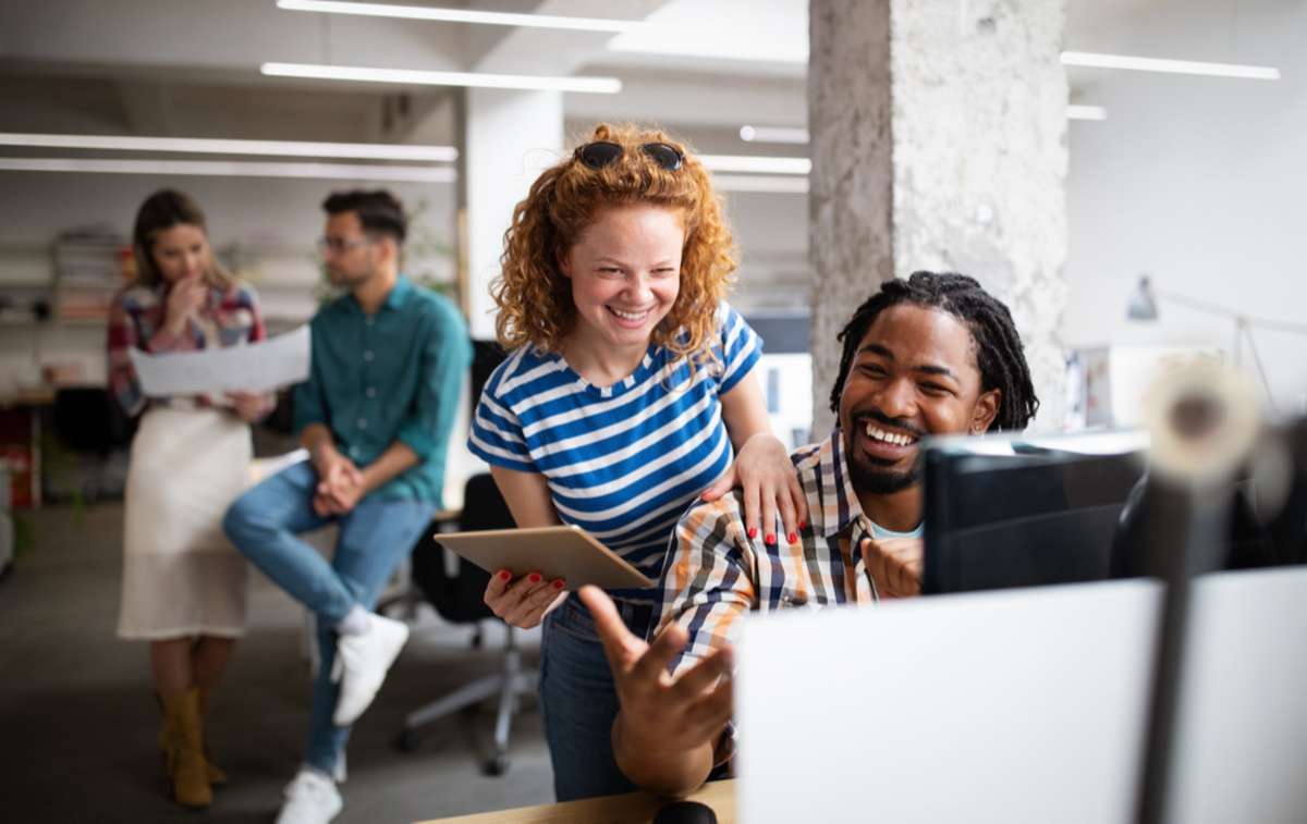 Group of business people and software developers working as a team in office