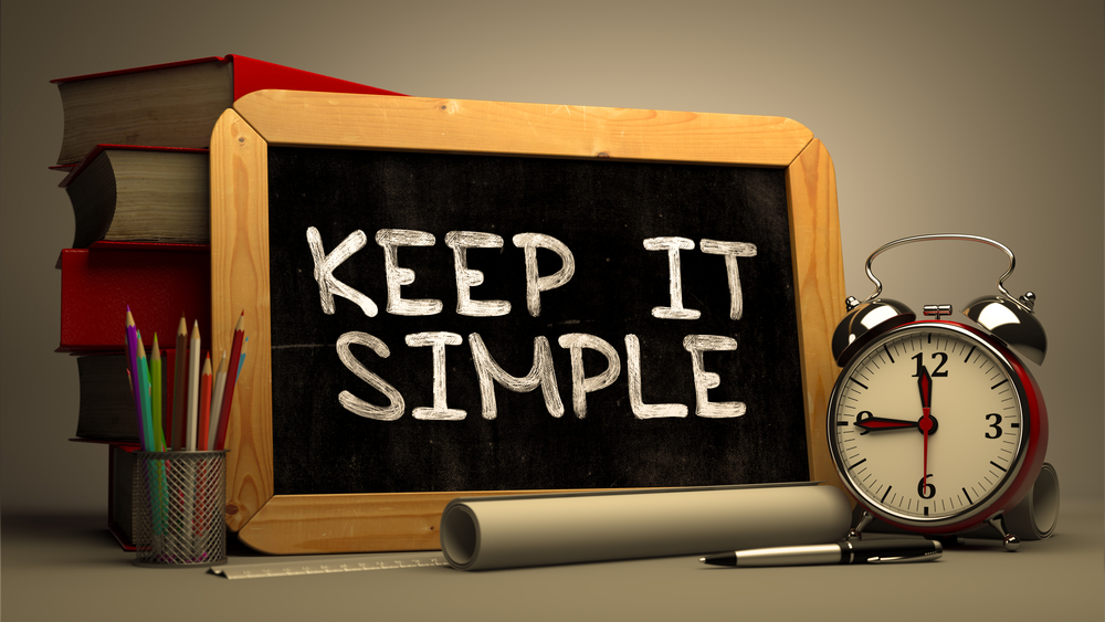 "Keep It Simple" on chalkboard, best property management websites concept.