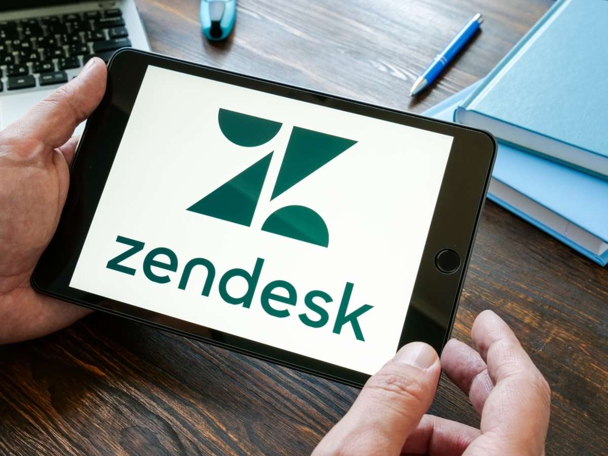 Hand holds Zendesk company logo