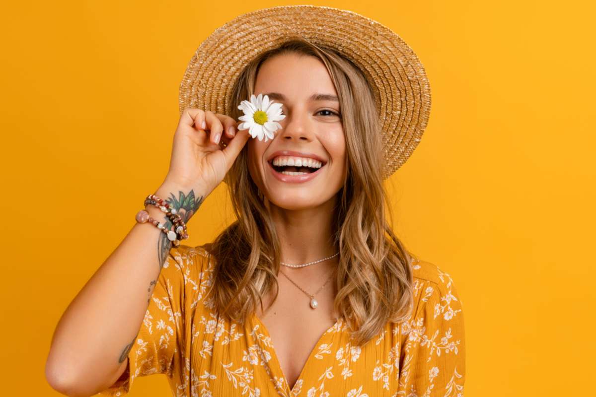 Happy young woman after updating old content for a property management blog