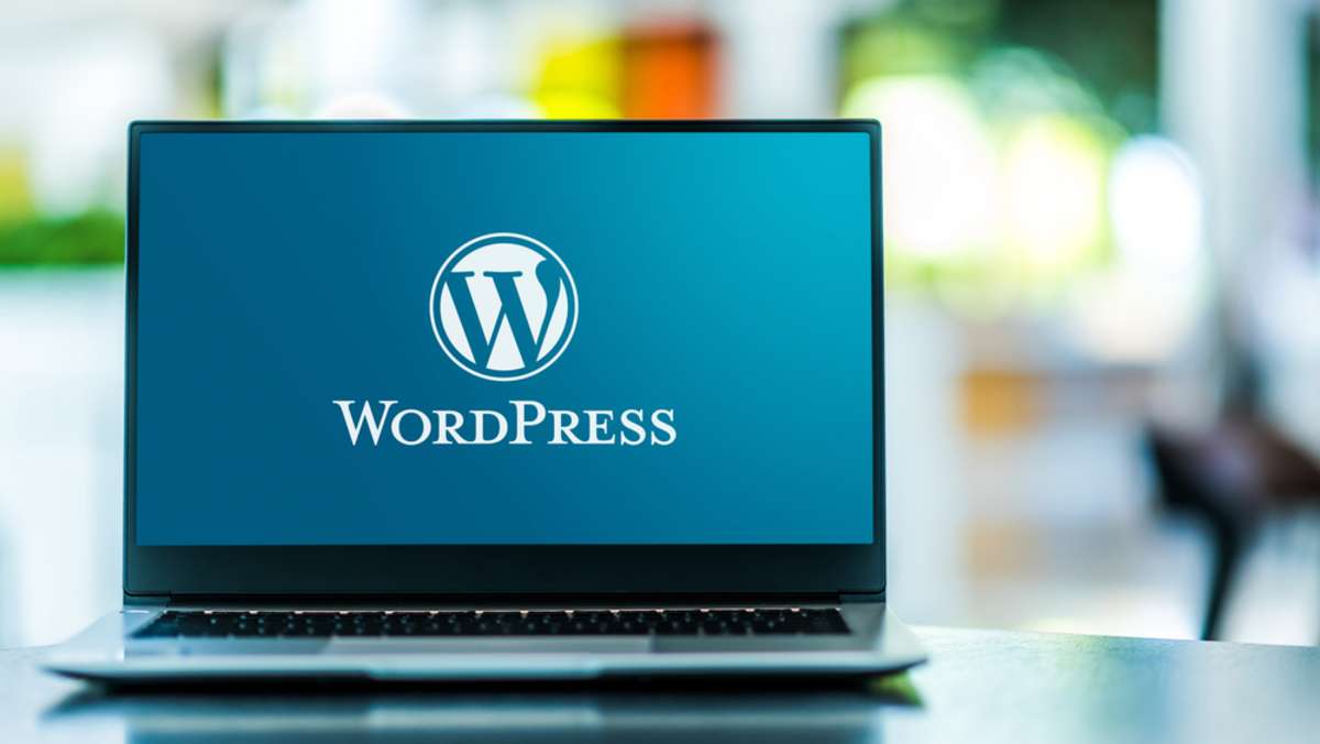 Laptop computer displaying logo of WordPress