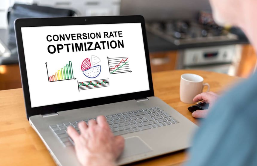 Man using a laptop with conversion rate optimization concept on the screen