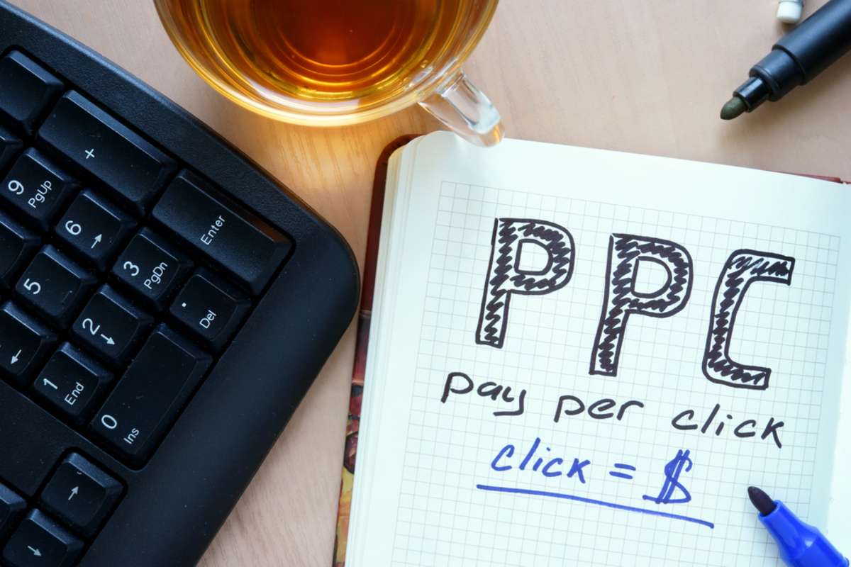 Notepad with words PPC pay per click concept and marker