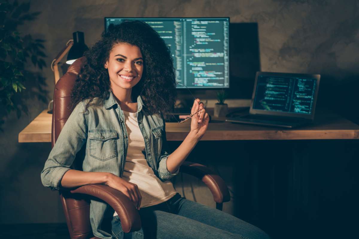 Portrait of positive skilled afro american girl web designer engineer