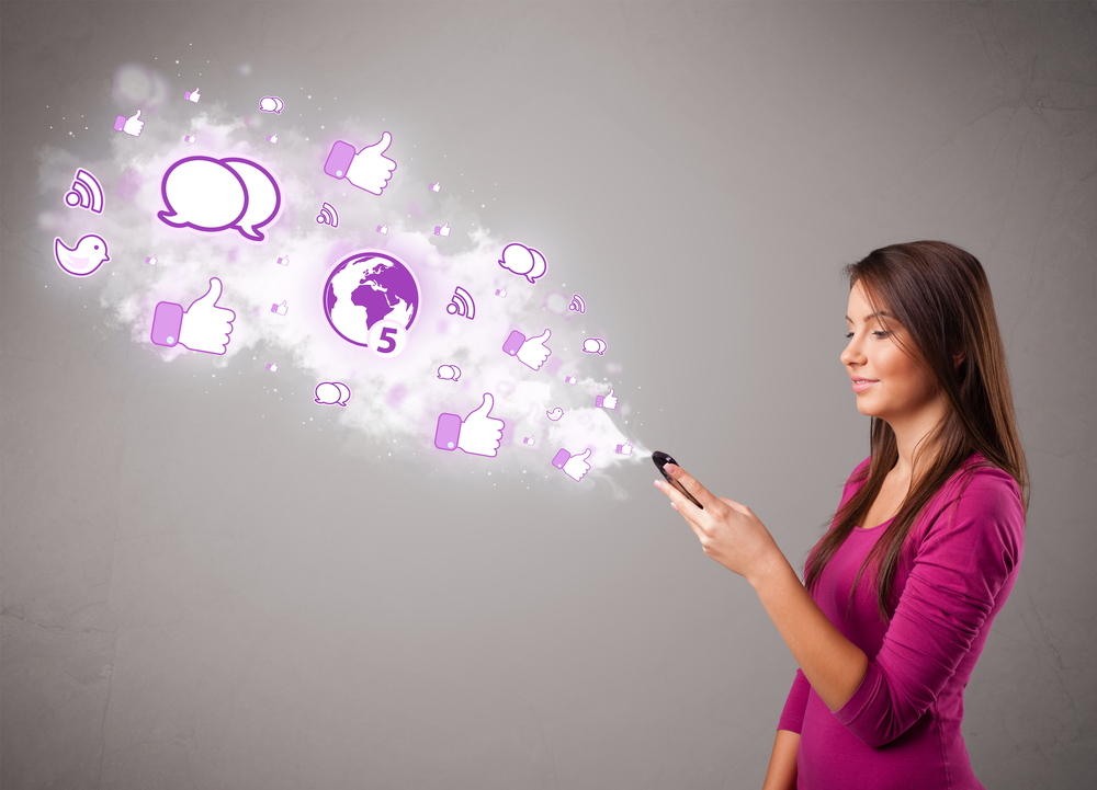 Girl holding a phone with social media icons in abstract cloud, property management marketing concept.