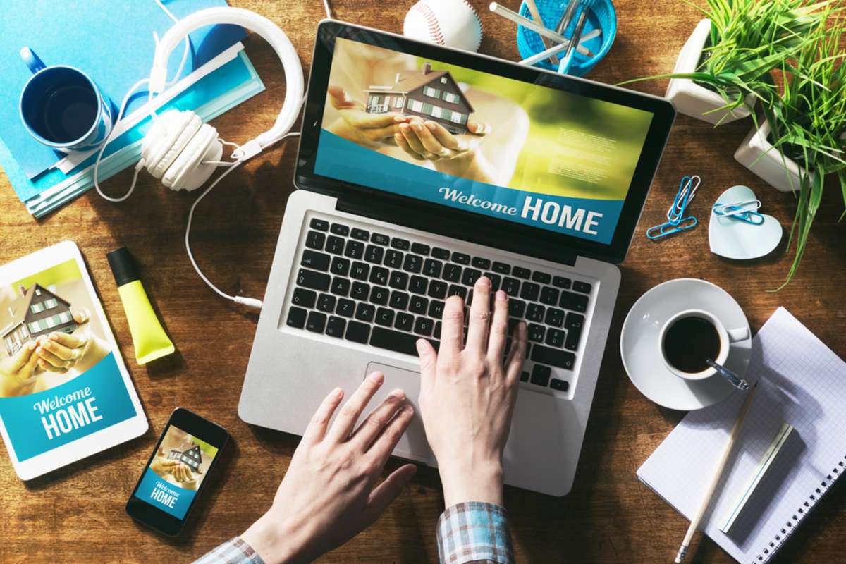 Real estate website mock up on laptop screen, tablet and smartphone
