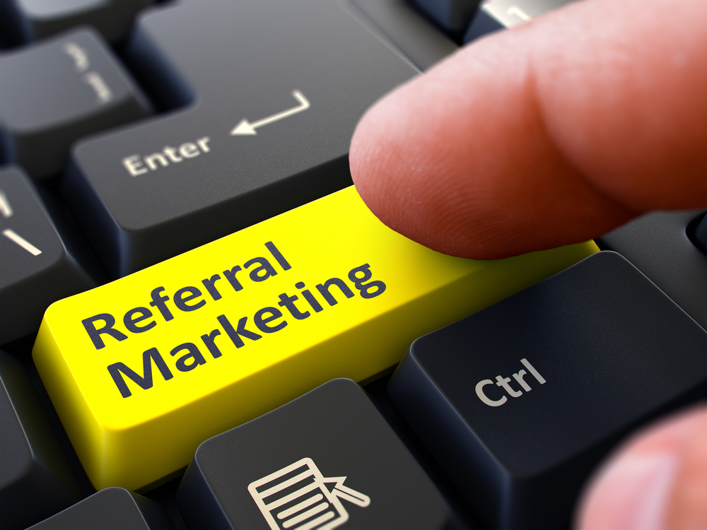 Referral Marketing Concept. Person Click on Yellow Keyboard Button. Selective Focus. Closeup View.