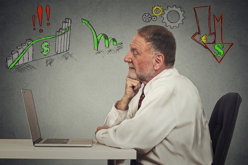Side profile view senior business man working on computer isolated on grey wall background. Anticipation of financial crisis, bad, poor economy concept. Corporate employee thinking, making decisions.
