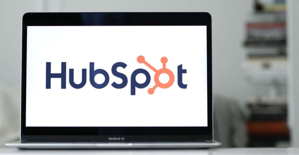 The logo of HubSpot displayed on the screen of a laptop