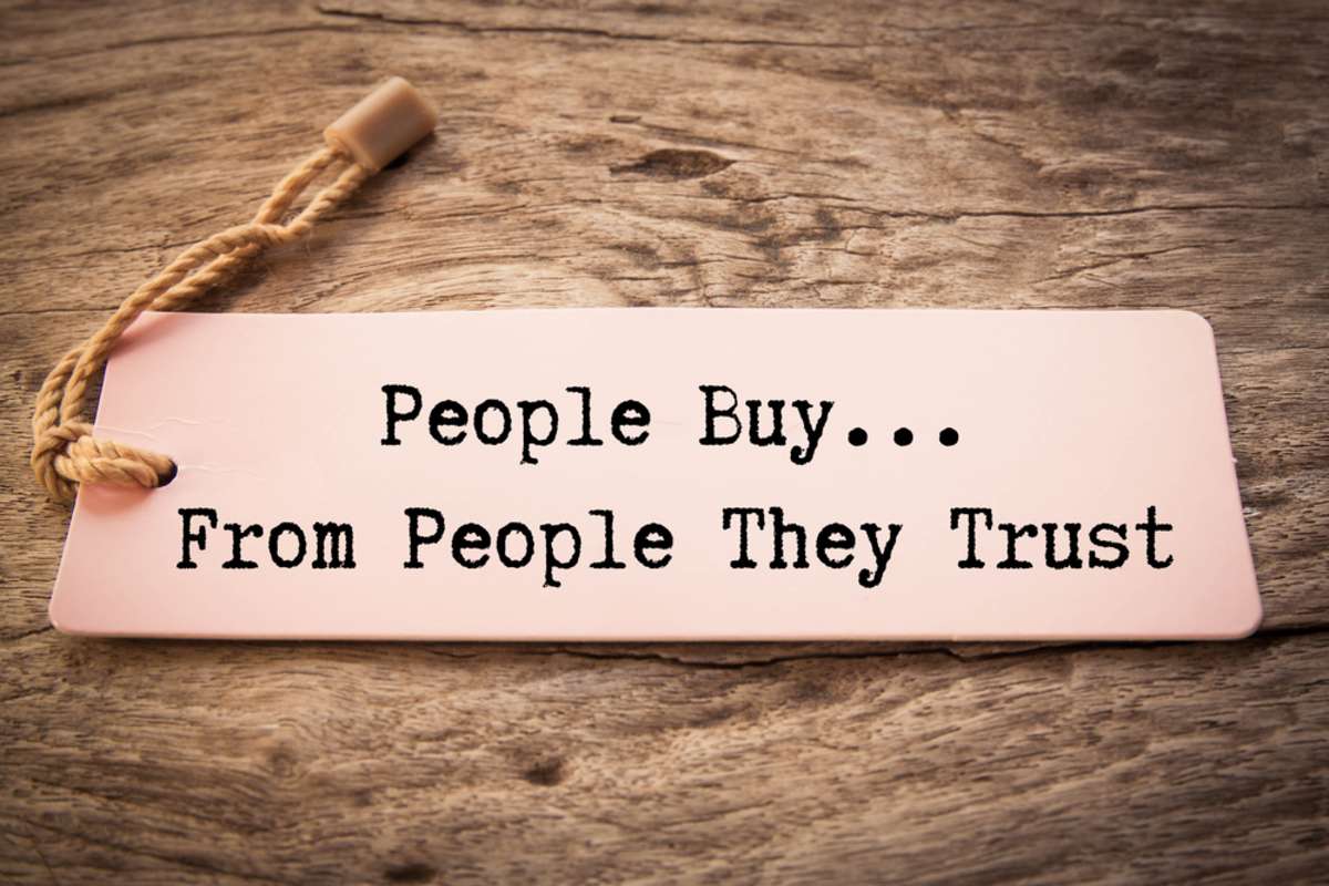 The phrase People Buy From People They Trust, brand perception concept. 