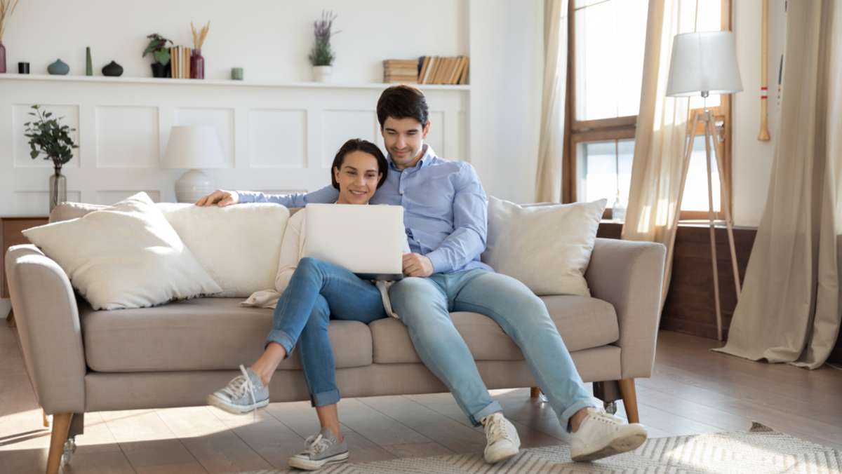 Young couple in love having date indoors, millennial married male and female owners