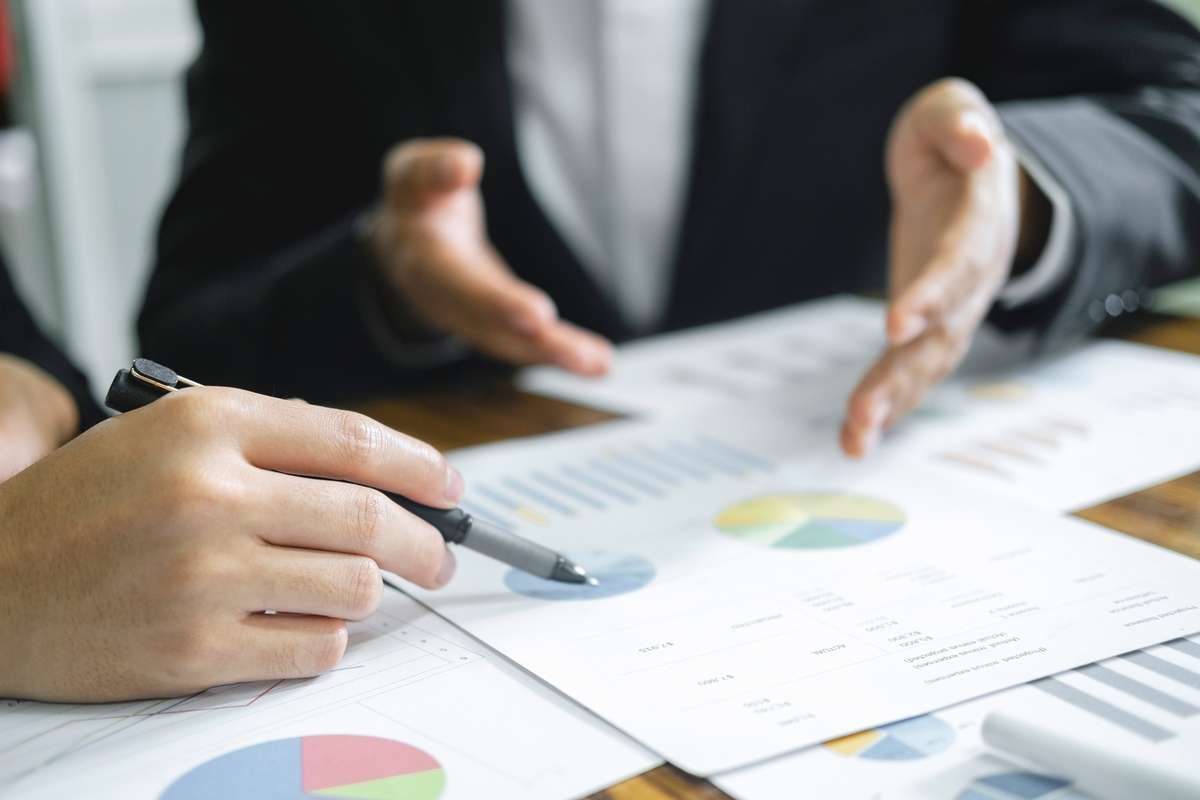 business man financial inspector and secretary making report calculating balance