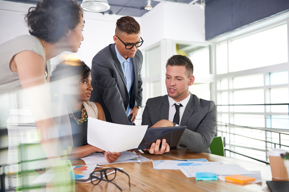 team of successful business people having a meeting in executive sunlit office-2