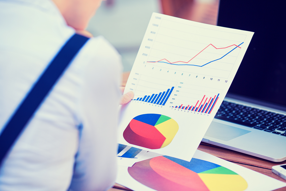 Woman analyzing data from a content audit. 