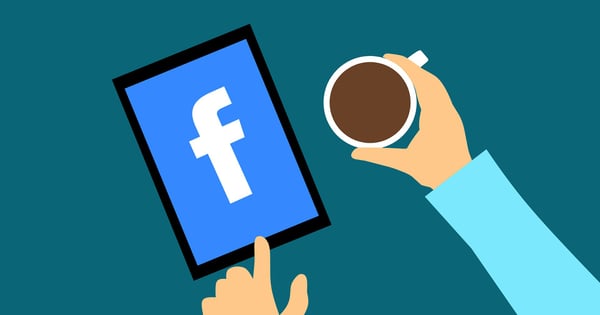 browsing Facebook while having a cup of coffee